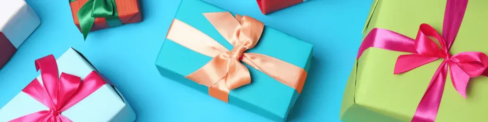 Flat lay composition with beautiful gift boxes on color background